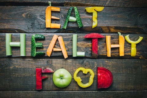 Eat Healthy Food spelled out in colrful fruit and veggies