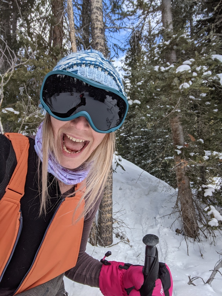 Kate Magsamen-Conrad takes a photo of herself skiing
