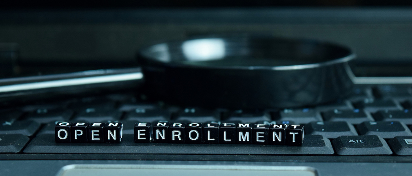Letters on a keyboard spelling out "open enrollment"