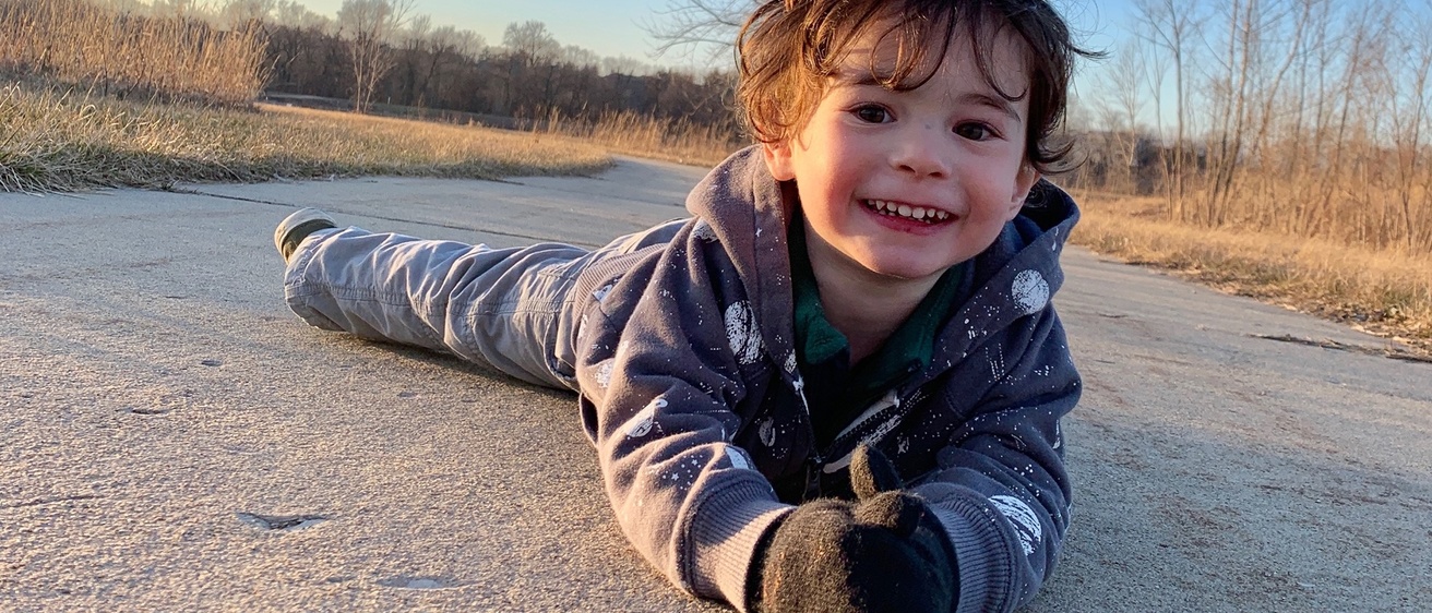J.J. Neiman-Brown outdoors and smiling.