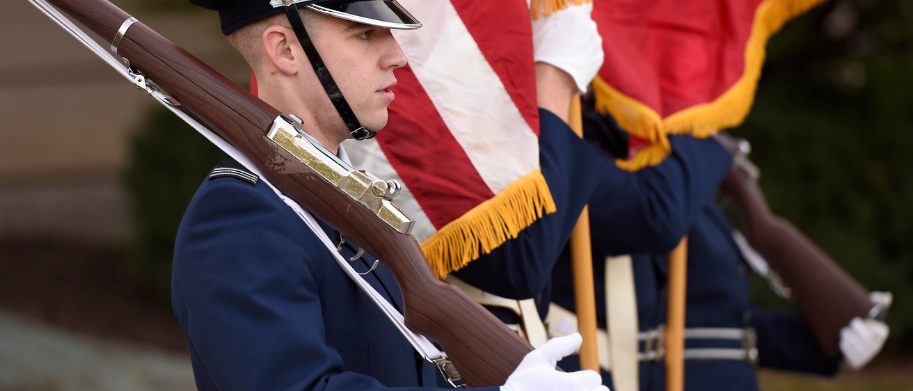 A military service member is shown in uniform on Veterans Day.