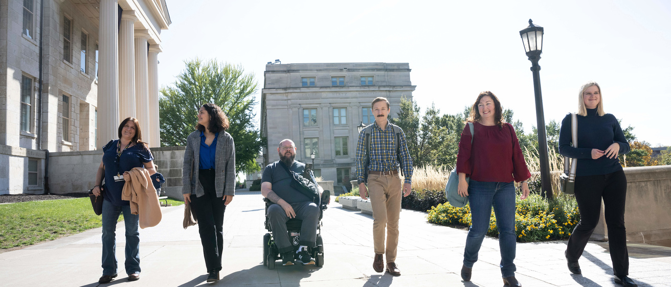 Photo of employees walking together on campus