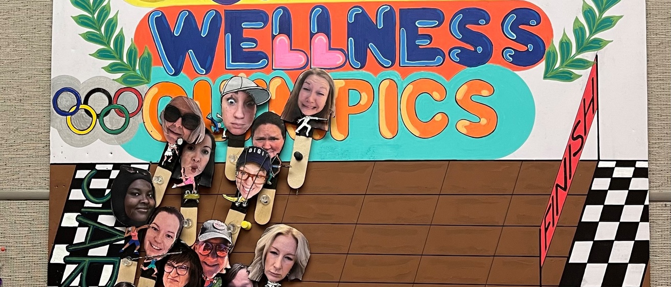 The Office Olympics leader board shows participants racing to the finish line