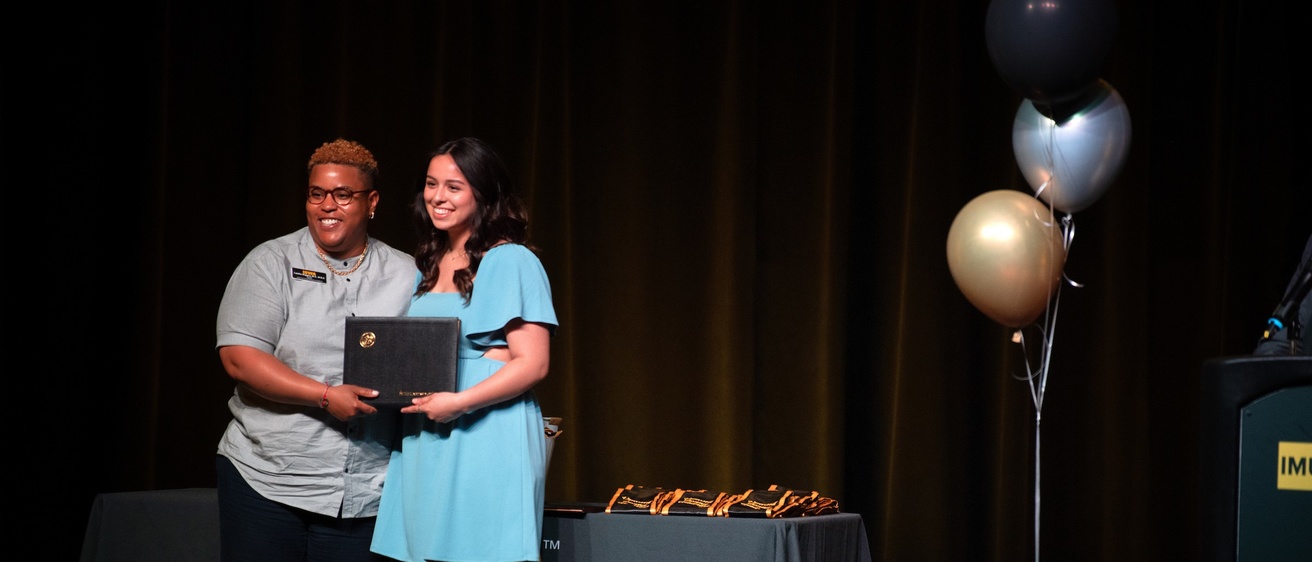 On-stage award winners at a celebration
