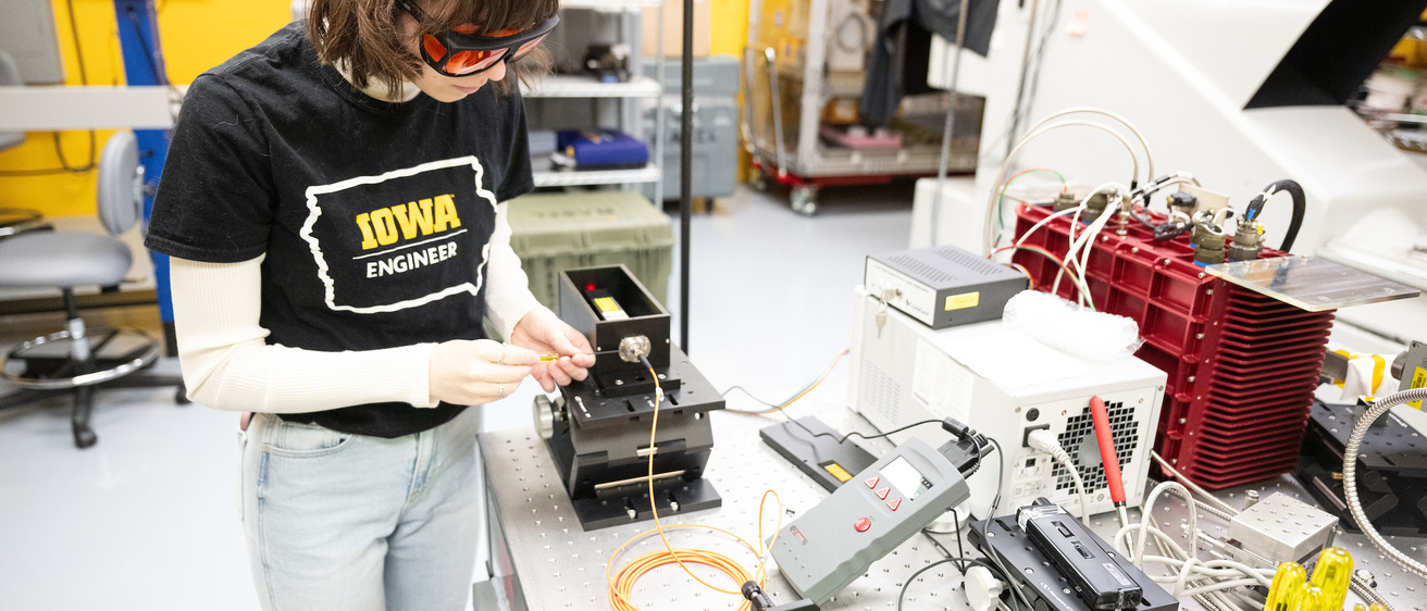 An engineering student works in a lab