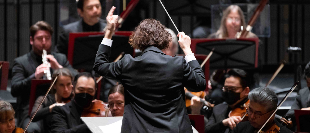conductor during an orchestra concert