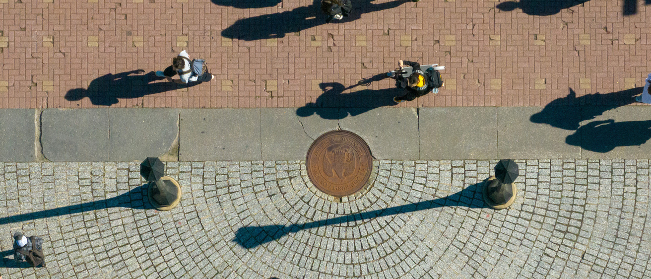 drone image of people walking on Pentacrest