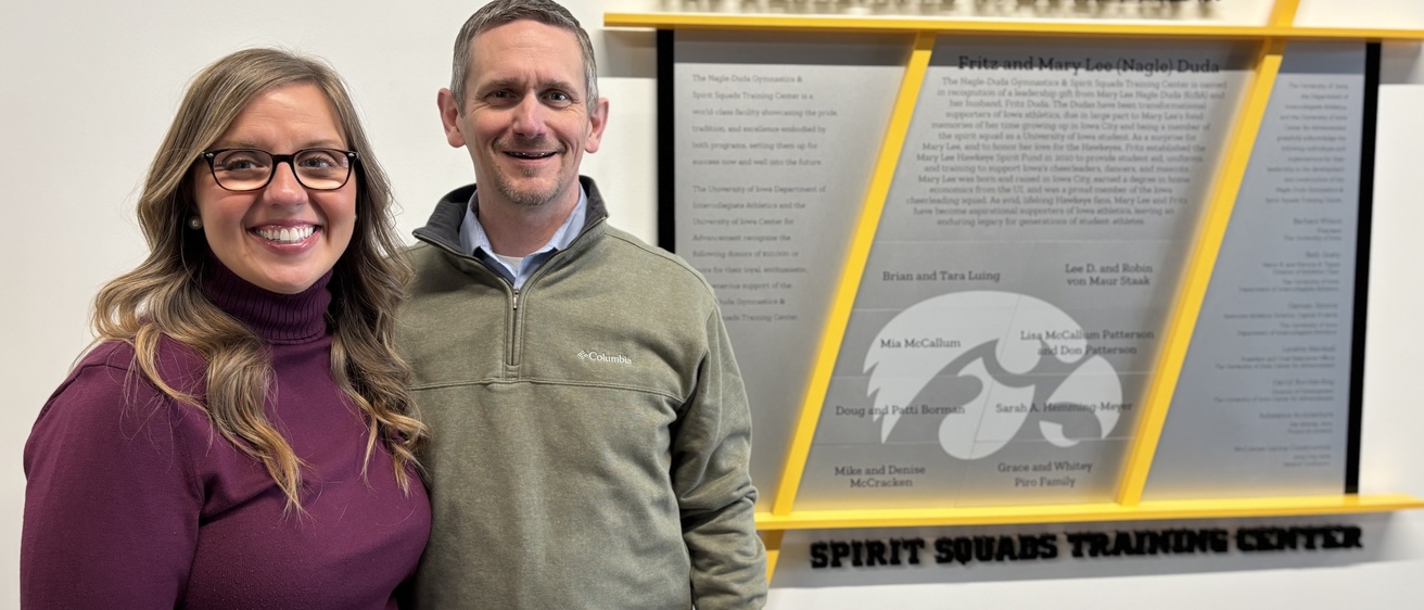 Jeff and Sarah Jones pose for a photo inside the Gymnastics and Spirit Squads Training Center