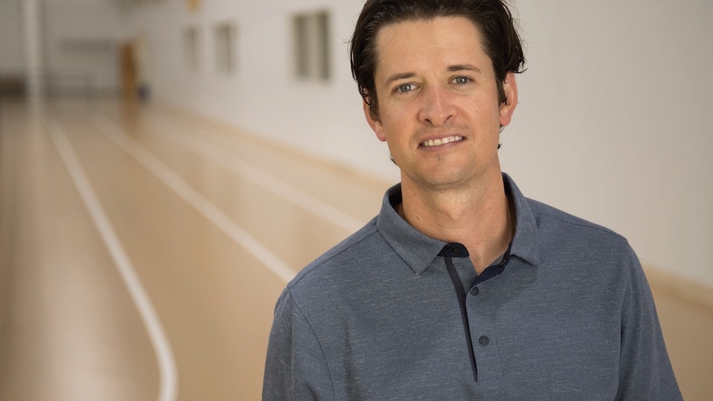 Portrait of Lucas Carr on an indoor track.