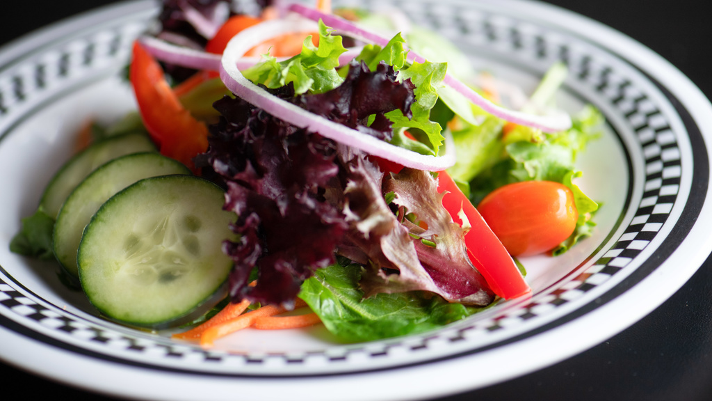 plate of salad greens and veggies