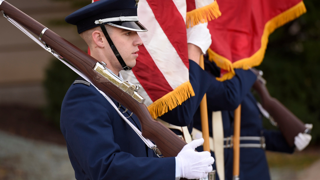 A military service member is shown in uniform on Veterans Day.
