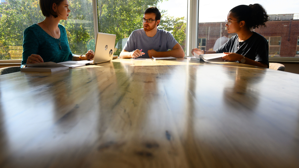 Employees sitting at table