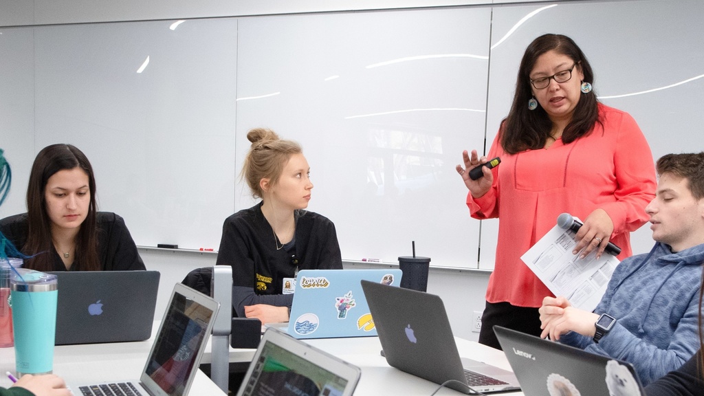 Faculty member with students