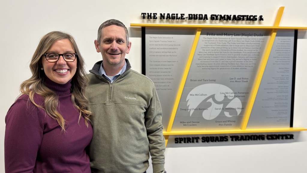 Jeff and Sarah Jones pose for a photo inside the Gymnastics and Spirit Squads Training Center